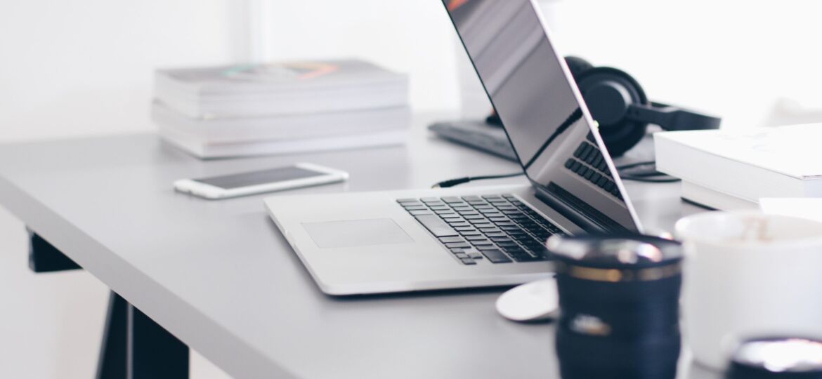 Free Gray Laptop on Table Top Stock Photo