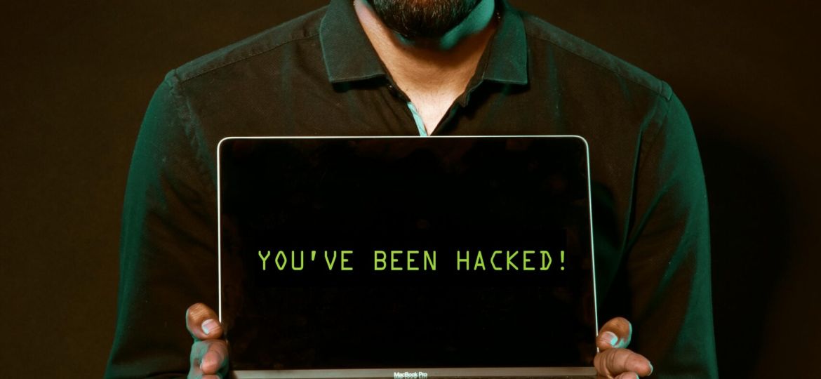 Free Man Holding Laptop Computer With Both Hands Stock Photo