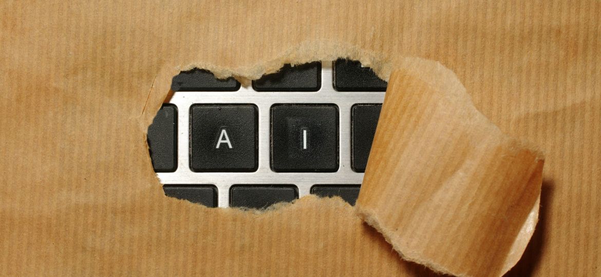 A piece of cardboard with a keyboard appearing through it