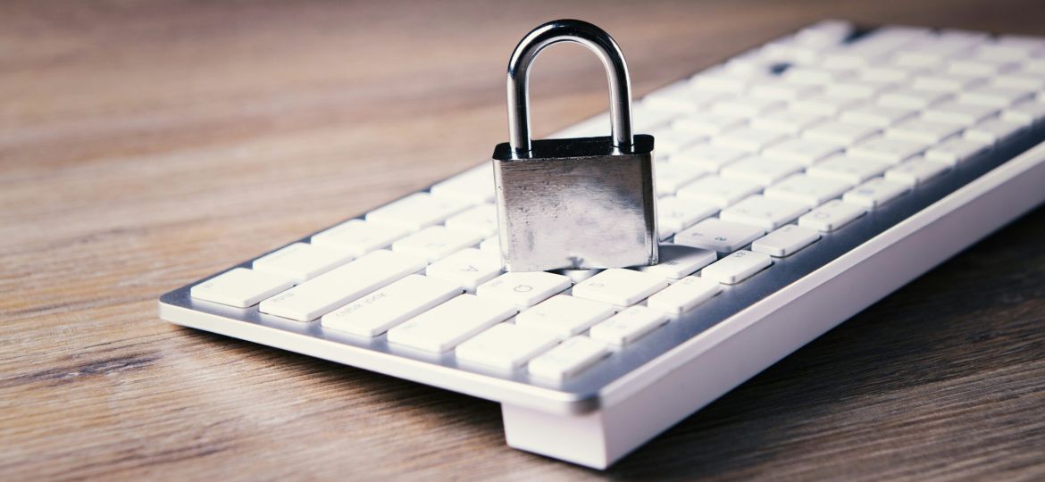 a computer keyboard with a padlock on top of it