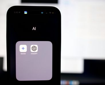 a close up of a cell phone with an ai button