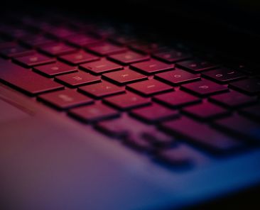 a-close-up-of-a-keyboard-with-a-blurry-background